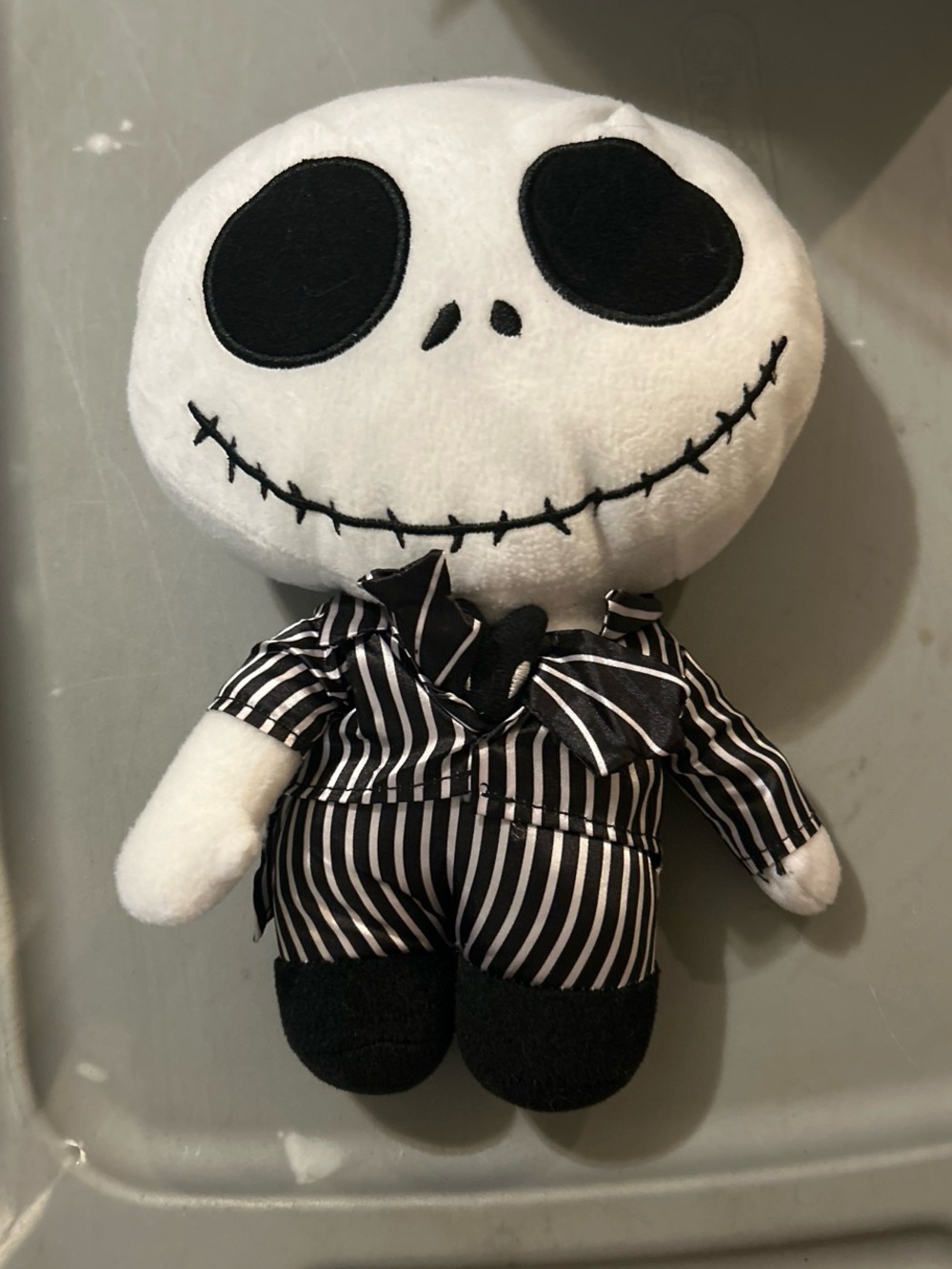 Plush Skeleton Character Toy in Black & White Striped Outfit